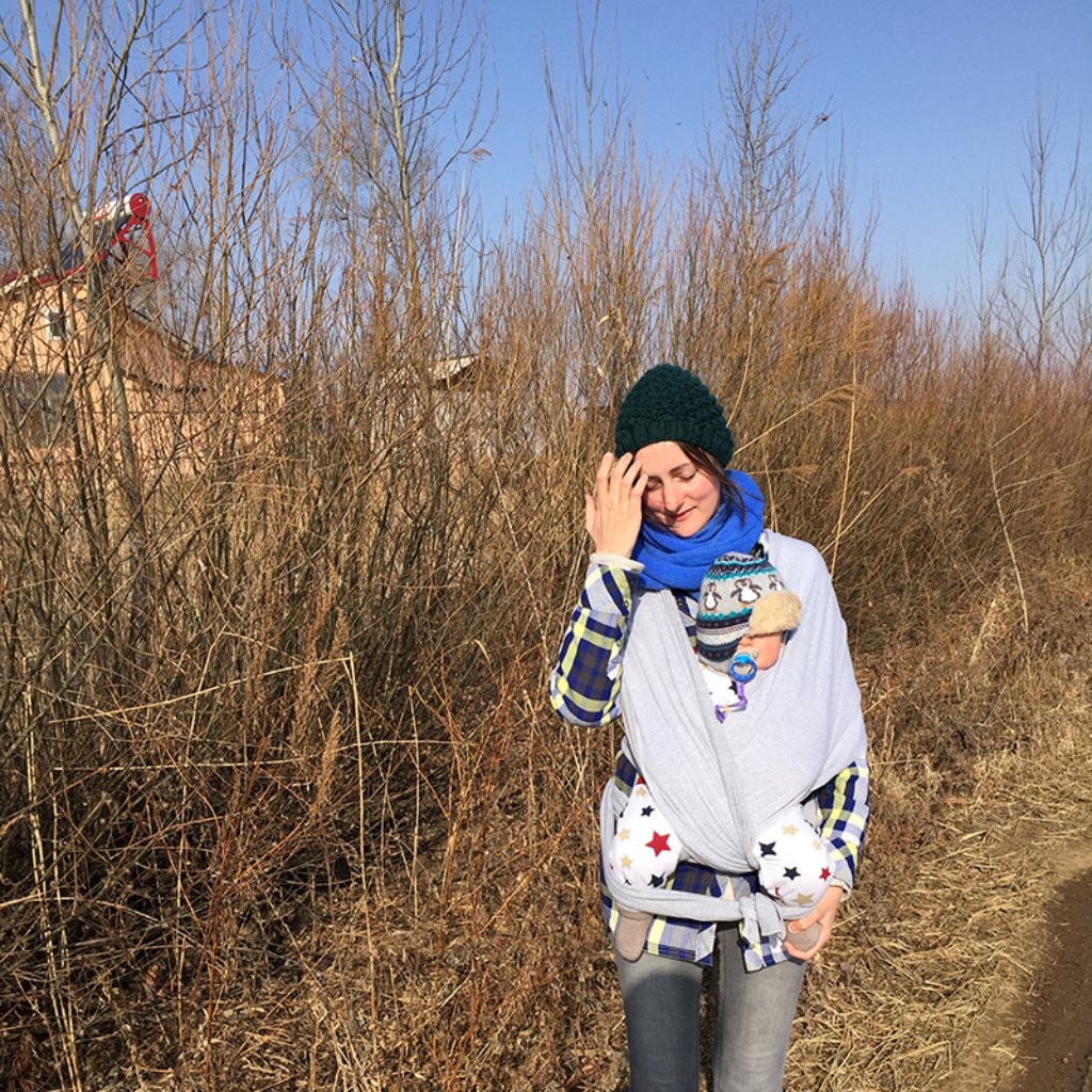 Ruth Silbermayr with her baby son on the day the Chinese family visists his great grandfather's grave