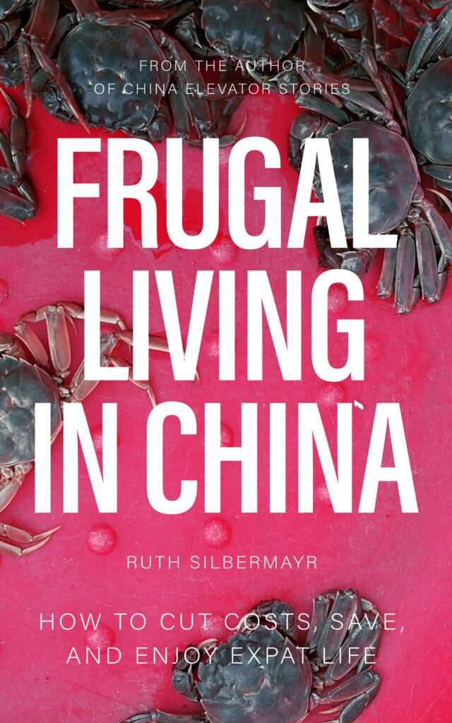 Book cover with the title FRUGAL LIVING IN CHINA in large white letters on a pink background, surrounded by crabs on the edges.
